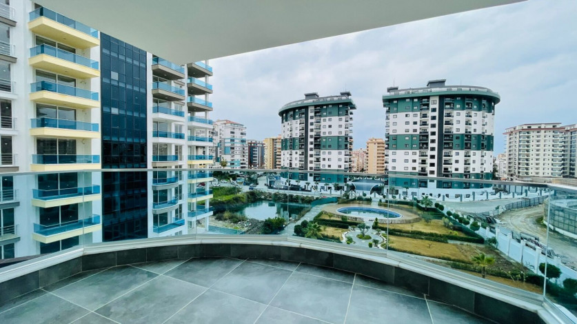 Меблированная двухкомнатная квартира в районе Махмутлар с видом на бассейн, 60м - Ракурс 3