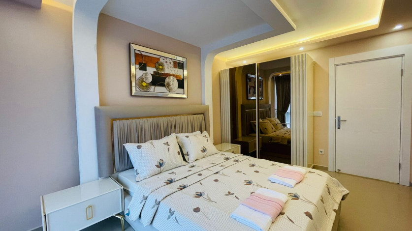 Меблированная двухкомнатная квартира в районе Махмутлар с видом на бассейн, 60м - Ракурс 7