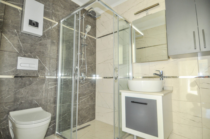 Двухкомнатная квартира в новой резиденции рядом с пляжем в районе Авсаллар, 55 м2 - Ракурс 10