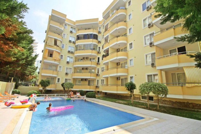 Квартира 1+1 в комплексе с крытым бассейном рядом с улицей Ататюрка в Махмутларе, 65 м2 - Ракурс 31