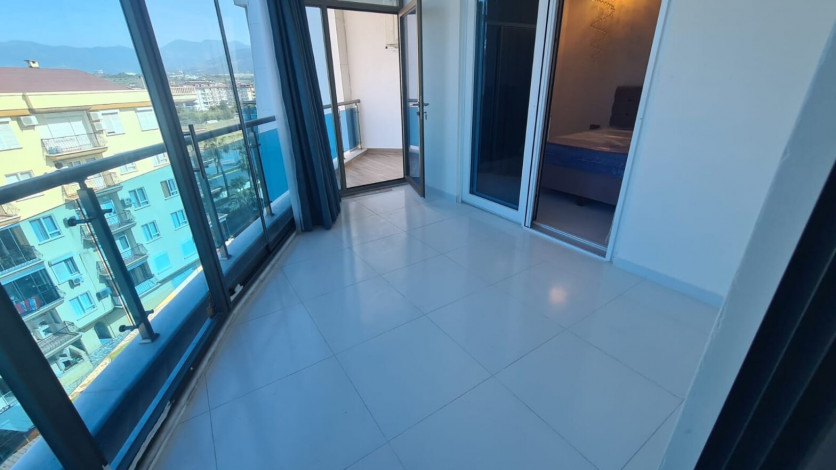 Двухкомнатная квартира на первой линии Махмутлара, площадью 80 м! - Ракурс 5