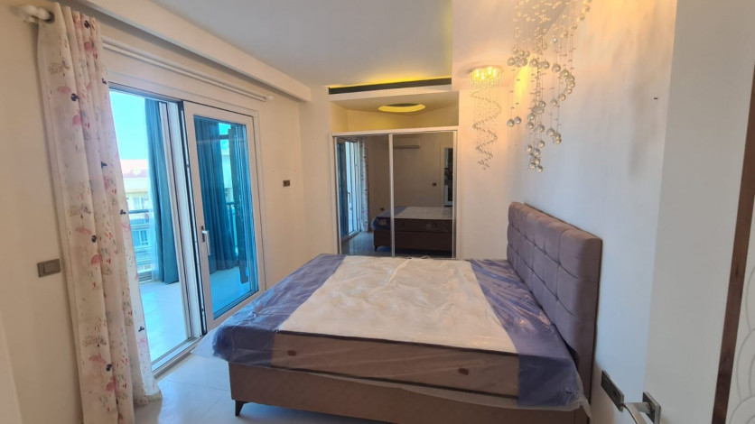 Двухкомнатная квартира на первой линии Махмутлара, площадью 80 м! - Ракурс 11