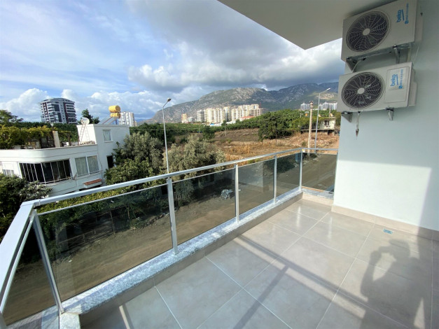 Квартира 1+1 в новом комплексе, район Махмутлар, 65 м2 - Ракурс 2