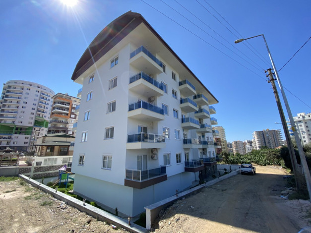 Квартира 1+1 в новом комплексе, район Махмутлар, 65 м2 - Ракурс 22