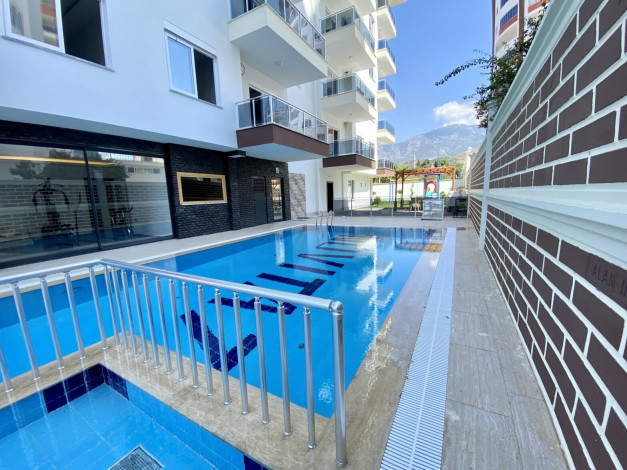 Квартира 1+1 в новом комплексе, район Махмутлар, 65 м2 - Ракурс 19