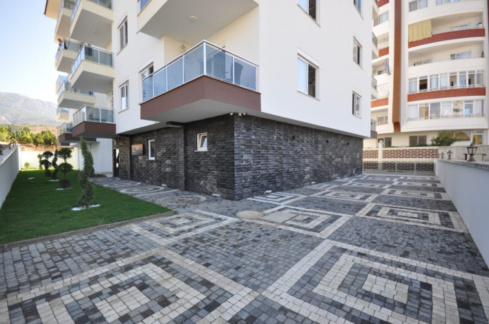 Новая меблированная квартира планировки 1+1, 56м2 в жилом комплексе в районе Махмутлар - Ракурс 1
