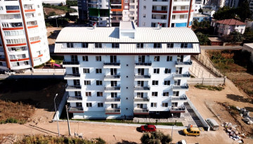 Новая меблированная квартира планировки 1+1, 56м2 в жилом комплексе в районе Махмутлар - Ракурс 6