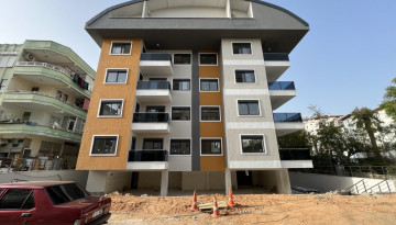 Квартиры планировок 1+1 и 2+1 в новом жилом комплексе в центре Алании - Ракурс 10