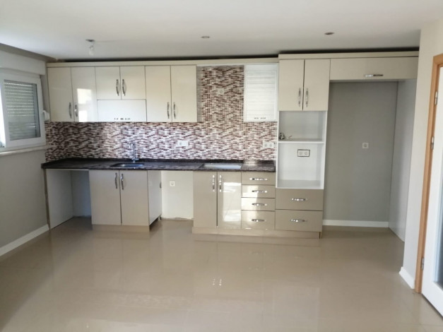 Квартира планировки 1+1 с большой	 площадью 75м2 в районе Авсаллар - Ракурс 6