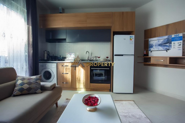 Меблированная квартира 1+1 по привлекательной цене рядом с морем в районе Махмутлар, 50 м2 - Ракурс 8