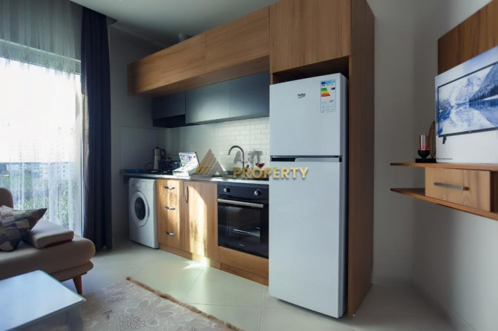 Меблированная квартира 1+1 по привлекательной цене рядом с морем в районе Махмутлар, 50 м2 - Ракурс 11