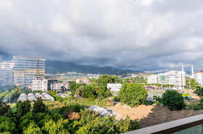 Красивая двухкомнатная квартира с шикарным видом на Торосские горы в Махмутларе, 50 м2 - Ракурс 3