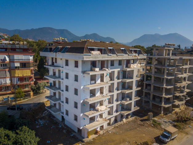 Новый современный инвестиционный проект с квартирами 1+1, 2+1 в районе Джикджилли - Ракурс 10