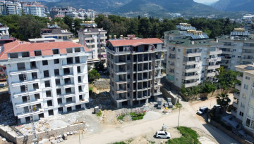 Новый инвестиционный проект с квартирами планировок 1+1, 2+1 и 3+1 в районе Джикджилли - Ракурс 7