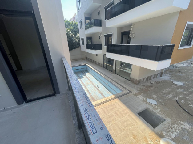 Две новые квартиры планировки 1+1, 55м2 в престижном районе в центре города Аланья - Ракурс 5