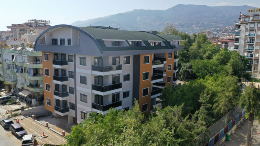 Две новые квартиры планировки 1+1, 55м2 в престижном районе в центре города Аланья - Ракурс 11