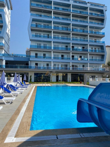 Меблированная квартира планировки 1+1, 58м2 в районе Махмутлар - Ракурс 30