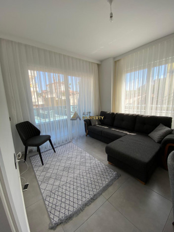 Меблированная квартира планировки 1+1, 58м2 в районе Махмутлар - Ракурс 64