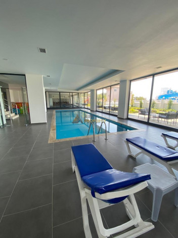 Меблированная квартира планировки 1+1, 58м2 в районе Махмутлар - Ракурс 67