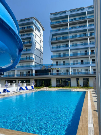 Меблированная квартира планировки 1+1, 58м2 в районе Махмутлар - Ракурс 84