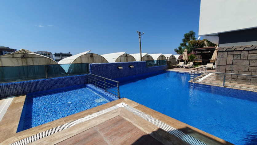 Меблированная квартира планировки 1+1, 58м2 в районе Махмутлар - Ракурс 92