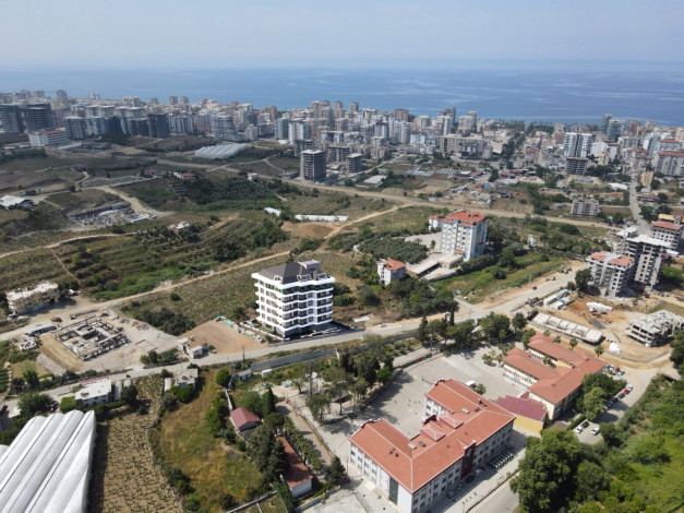 Старт нового инвестиционного проекта с квартирами 1+1, 2+1, 3+1 в районе Махмутлар - Ракурс 13