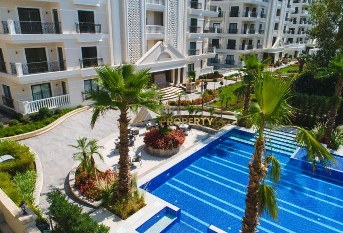 Квартиры 1+1 и 2+1 в лучшем комплексе Алании! 68-271 м2 - Ракурс 86