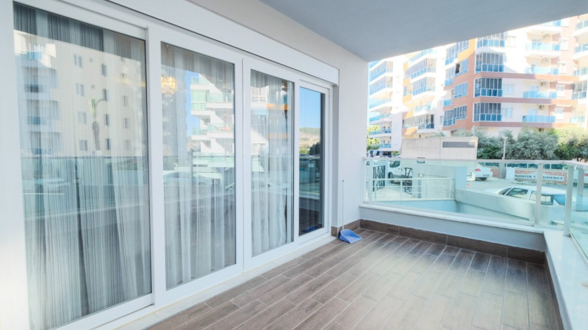 Меблированная квартира планировки 1+1, 70м2 в районе Махмутлар - Ракурс 9