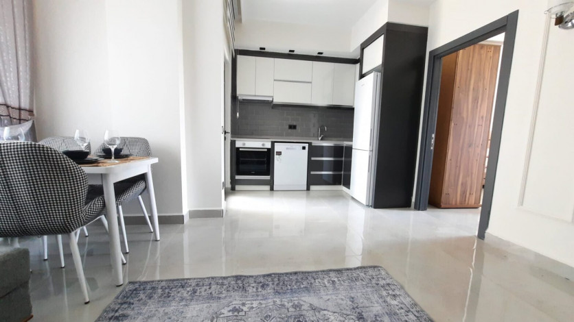 Новая меблированная квартира планировки 1+1, 55м2 с видом на древний город Наула, Махмутлар - Ракурс 7