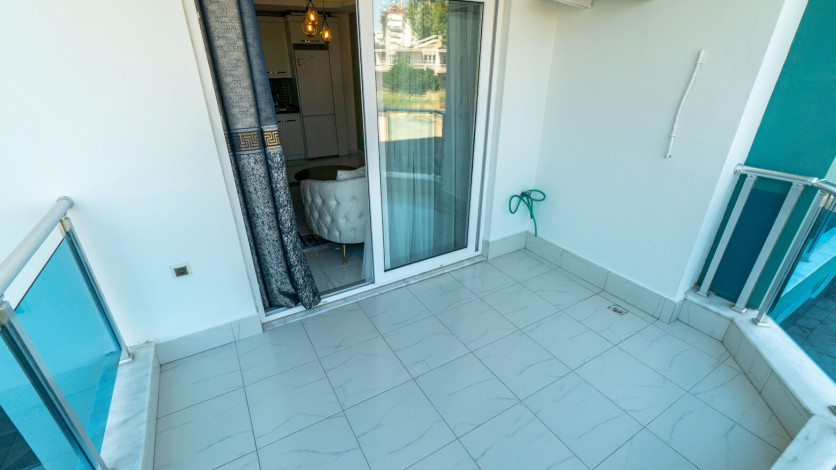 Уютная меблированная квартира планировки 1+1, 55м2 в районе Махмутлар - Ракурс 26