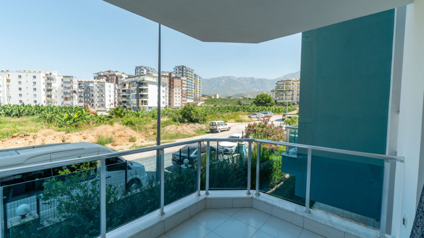 Уютная меблированная квартира планировки 1+1, 55м2 в районе Махмутлар - Ракурс 27