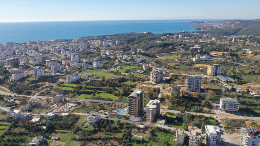 Новый проект с апартаментами планировки 1+1 и 5+1 в районе Авсаллар - Ракурс 2