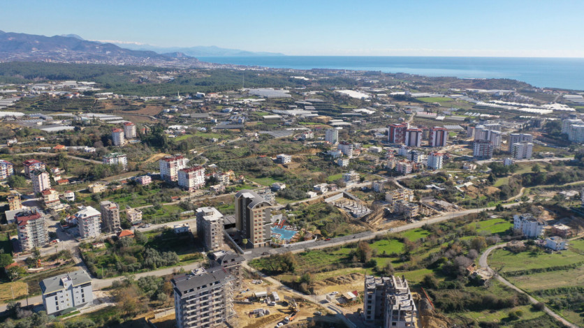 Новый проект с апартаментами планировки 1+1 и 5+1 в районе Авсаллар - Ракурс 3