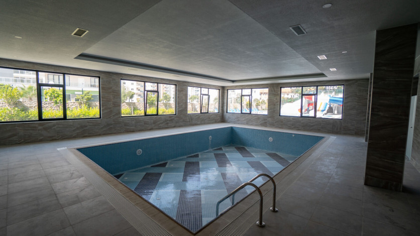 Меблированная квартира планировки 1+1, 50м2 в новом доме, район Махмутлар - Ракурс 3