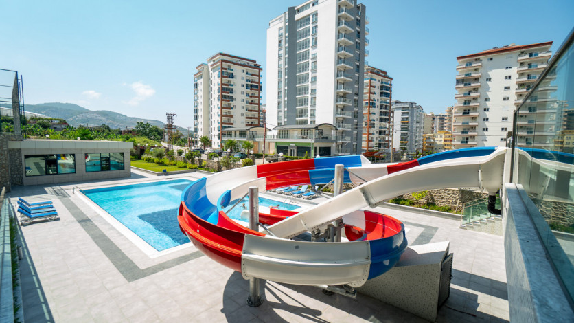 Меблированная квартира планировки 1+1, 50м2 в новом доме, район Махмутлар - Ракурс 15