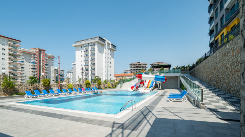 Меблированная квартира планировки 1+1, 50м2 в новом доме, район Махмутлар - Ракурс 16