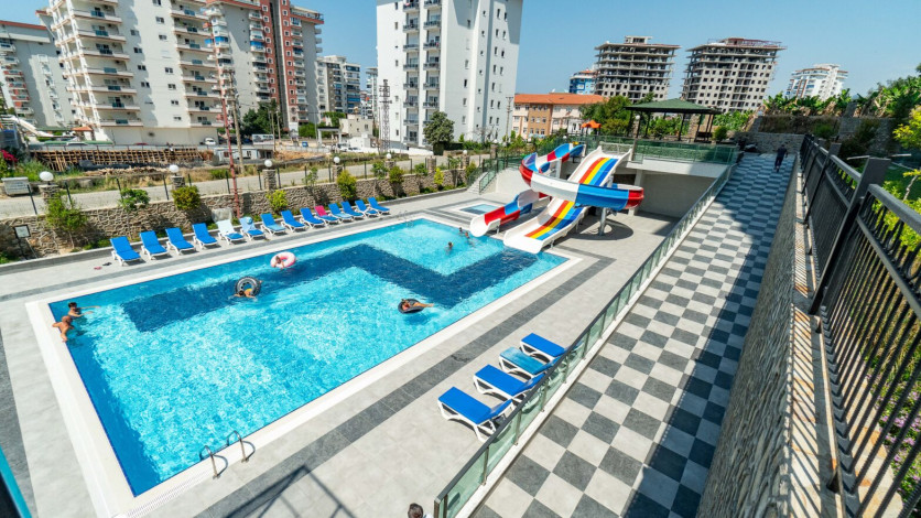 Меблированная квартира планировки 1+1, 50м2 в новом доме, район Махмутлар - Ракурс 17