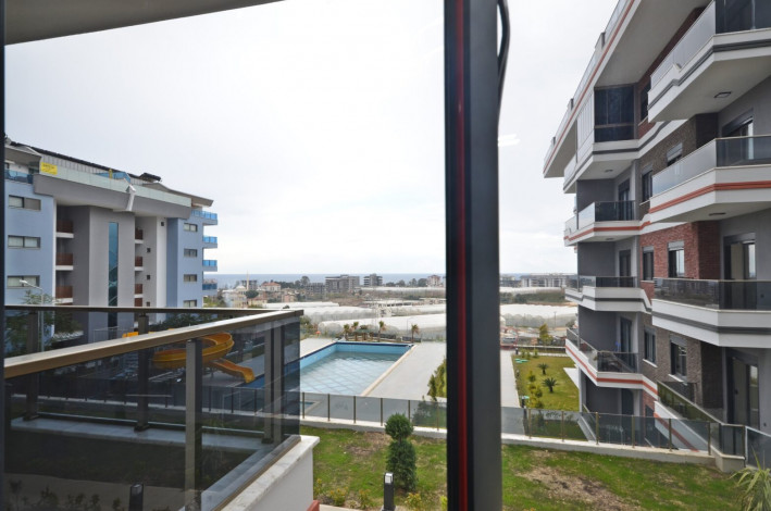 Шикарная меблированная квартира планировки 1+1, 50м2 с видом на море, район Каргыджак - Ракурс 12