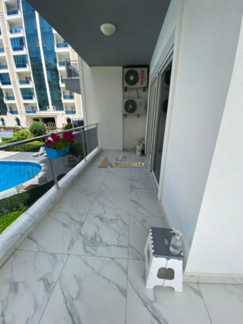 Меблированная квартира планировки 1+1, 60м2 в районе Махмутлар - Ракурс 12