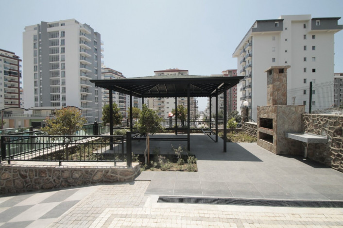 Апартаменты планировки 1+1, 65м2 в новом жилом комплексе в районе Махмутлар - Ракурс 2