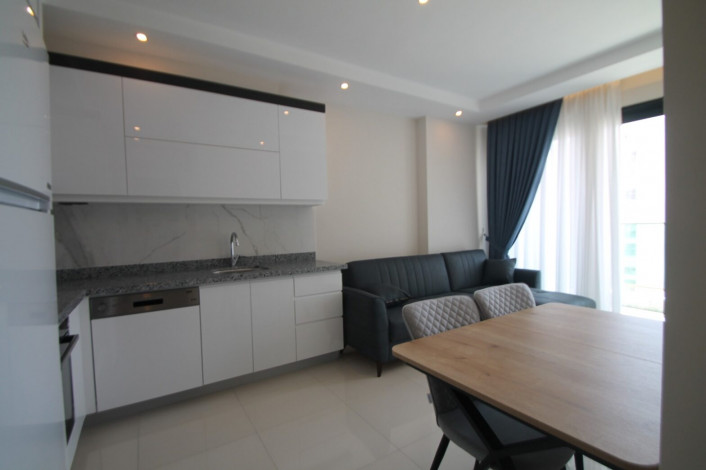 Апартаменты планировки 1+1, 65м2 в новом жилом комплексе в районе Махмутлар - Ракурс 9