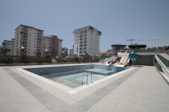 Апартаменты планировки 1+1, 65м2 в новом жилом комплексе в районе Махмутлар - Ракурс 22