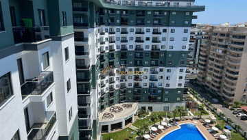 Апартаменты планировки 1+1 в комплексе уровня отеля 5*, район Махмутлар - Ракурс 1