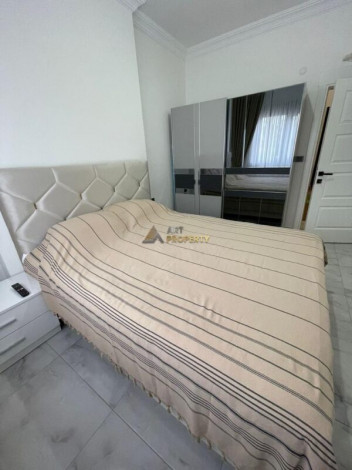 Уютная меблированная квартира планировки 1+1, 55м2 рядом с древним городом Наула, Махмутлар - Ракурс 5