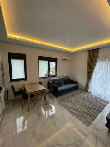 Уютная меблированная квартира планировки 1+1, 55м2 рядом с древним городом Наула, Махмутлар - Ракурс 14