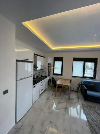 Уютная меблированная квартира планировки 1+1, 55м2 рядом с древним городом Наула, Махмутлар - Ракурс 19