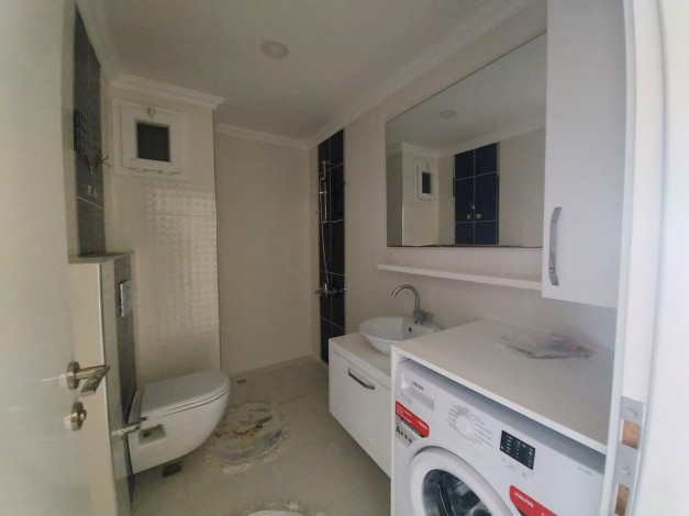 Квартира 1+1 с мебелью  и комплектом бытовой техники в районе  Махмутлар Алания, 68 м2 - Ракурс 8