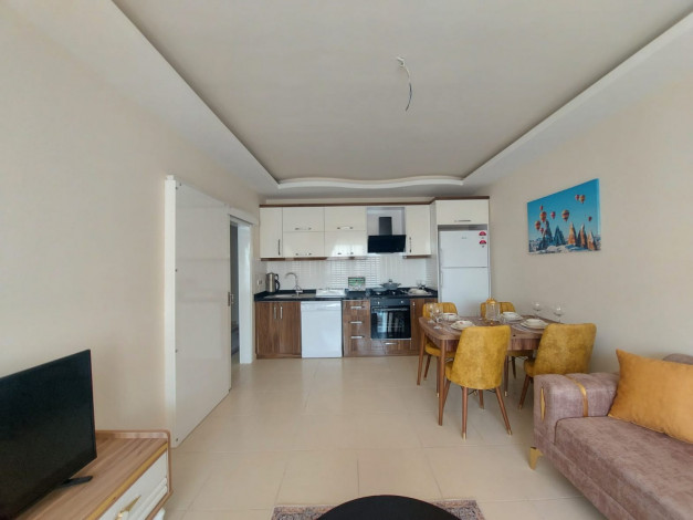 Квартира 1+1 с мебелью  и комплектом бытовой техники в районе  Махмутлар Алания, 68 м2 - Ракурс 12