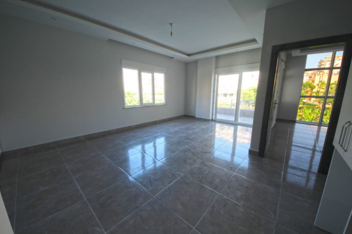 В центре района Махмутлар двухкомнатная квартира с современным ремонтом, 65 м2 - Ракурс 3