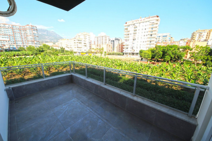 В центре района Махмутлар двухкомнатная квартира с современным ремонтом, 65 м2 - Ракурс 7